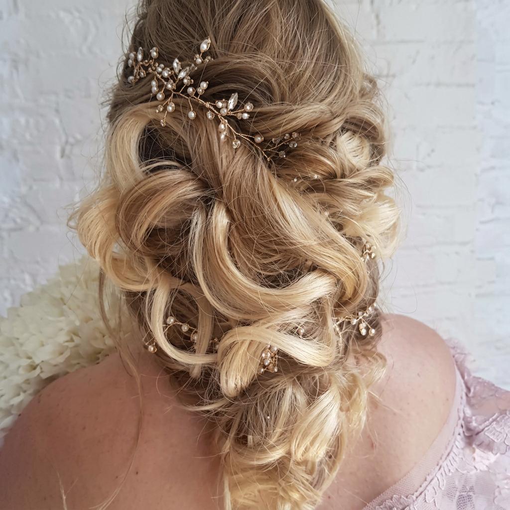Textured bridal updo with a crystal hairpiece by Salon DP Lorana